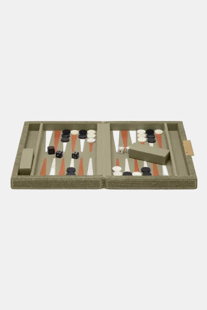 Backgammon set with pieces and dice on a beige background