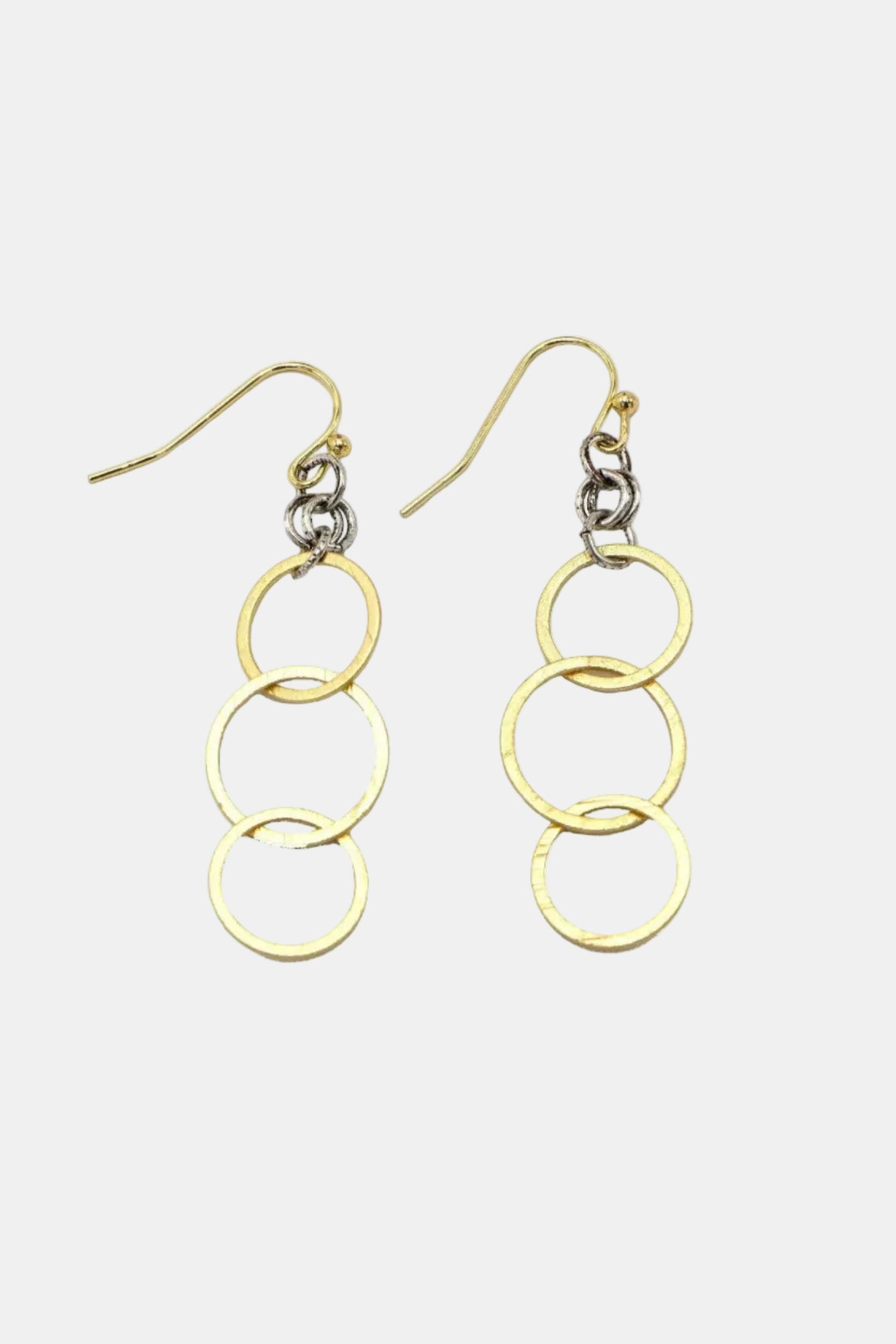Gold chain earrings on a white background