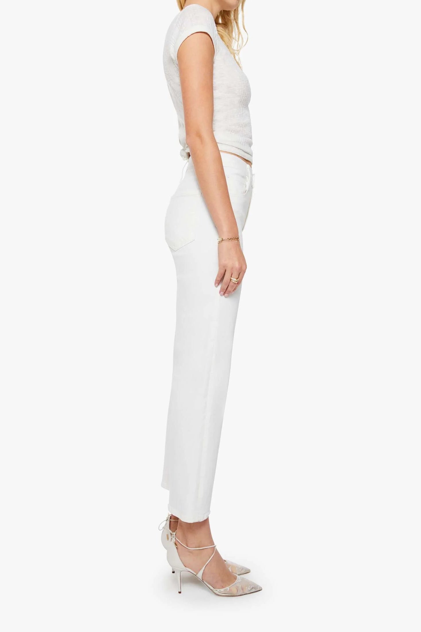 Woman wearing a white outfit on a white background