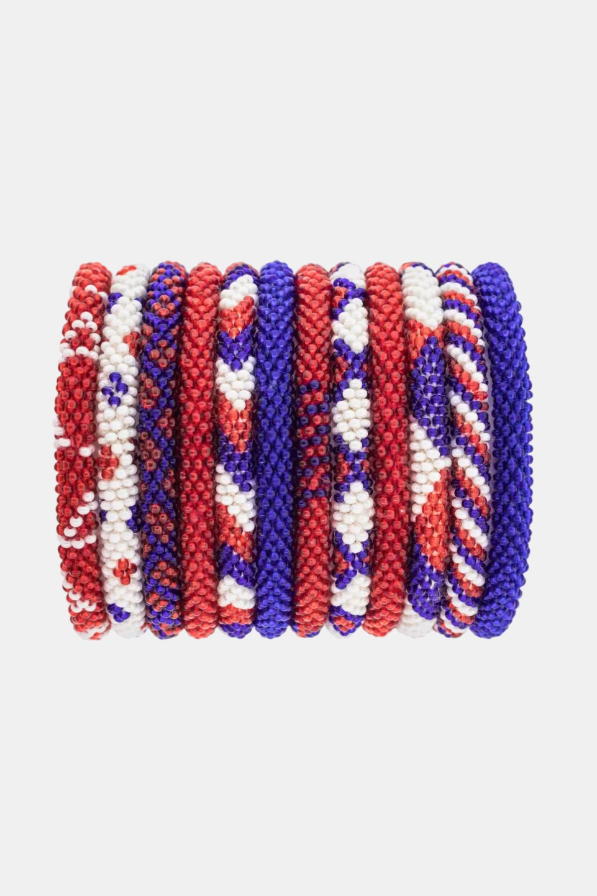 Set of red, white, and blue beaded bracelets on a white background