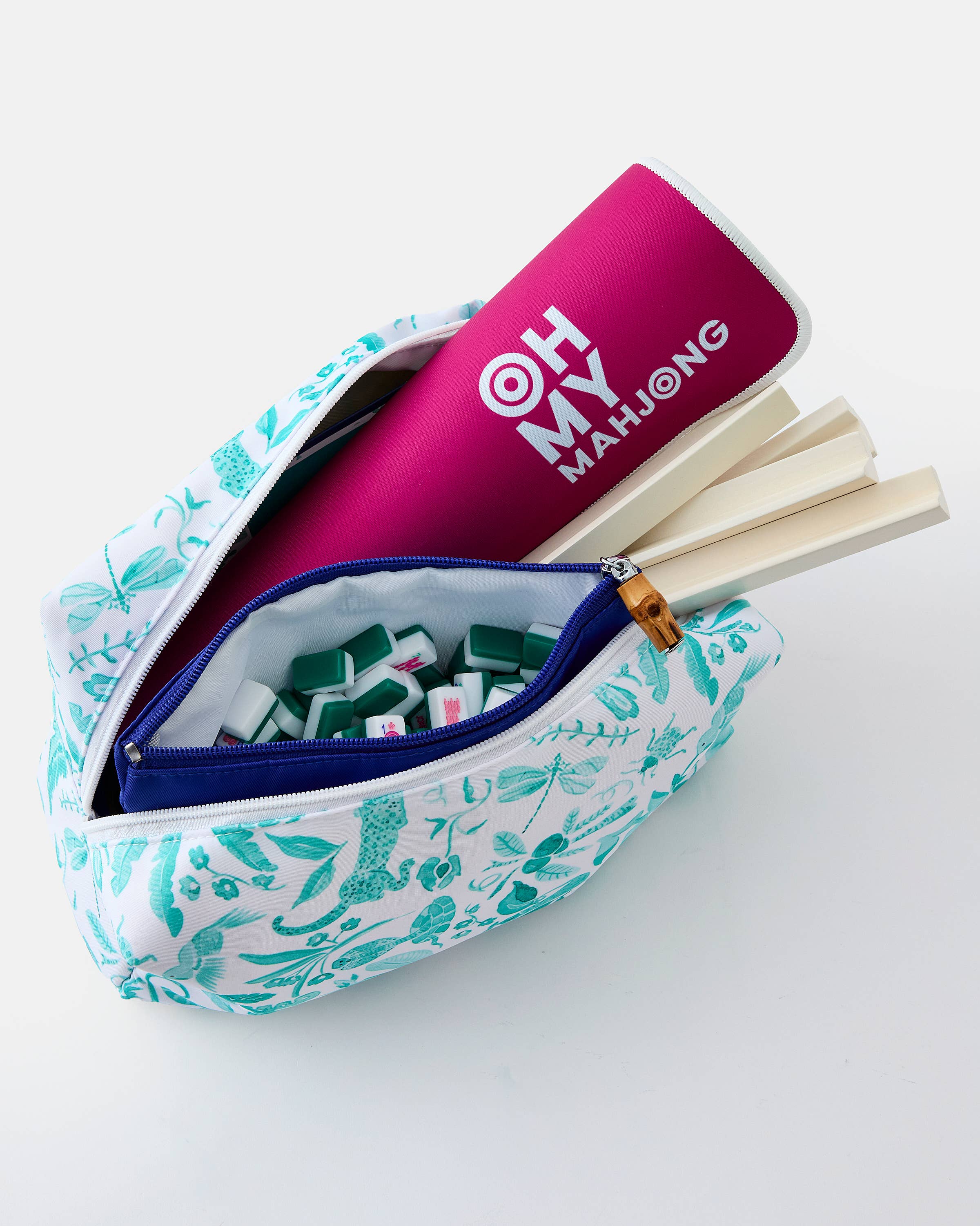 Mahjong set with a pink 'Oh My Mahjong' container in a floral pouch on a white background