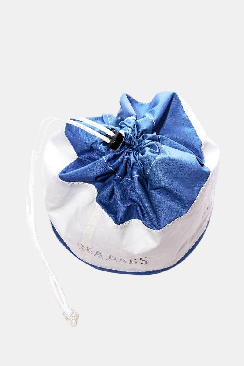 White drawstring bag with blue top on a white background