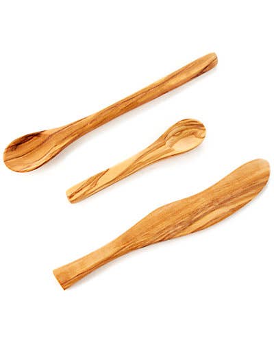 Three wooden spoons on a white background