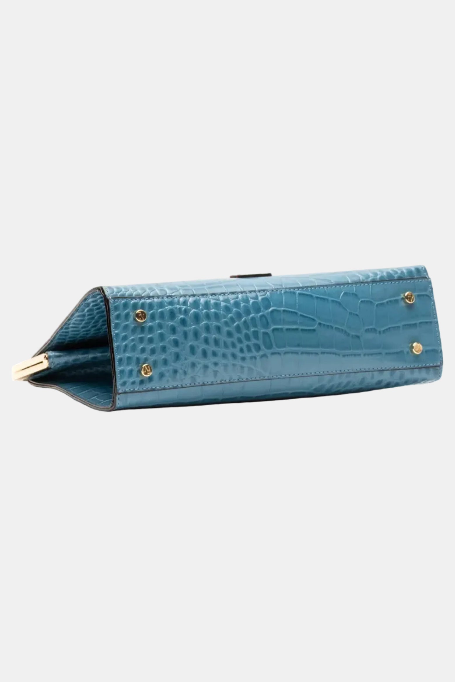 A blue crocodile-embossed leather clutch bag with gold-tone metal studs, shown from a side angle on a plain white background.