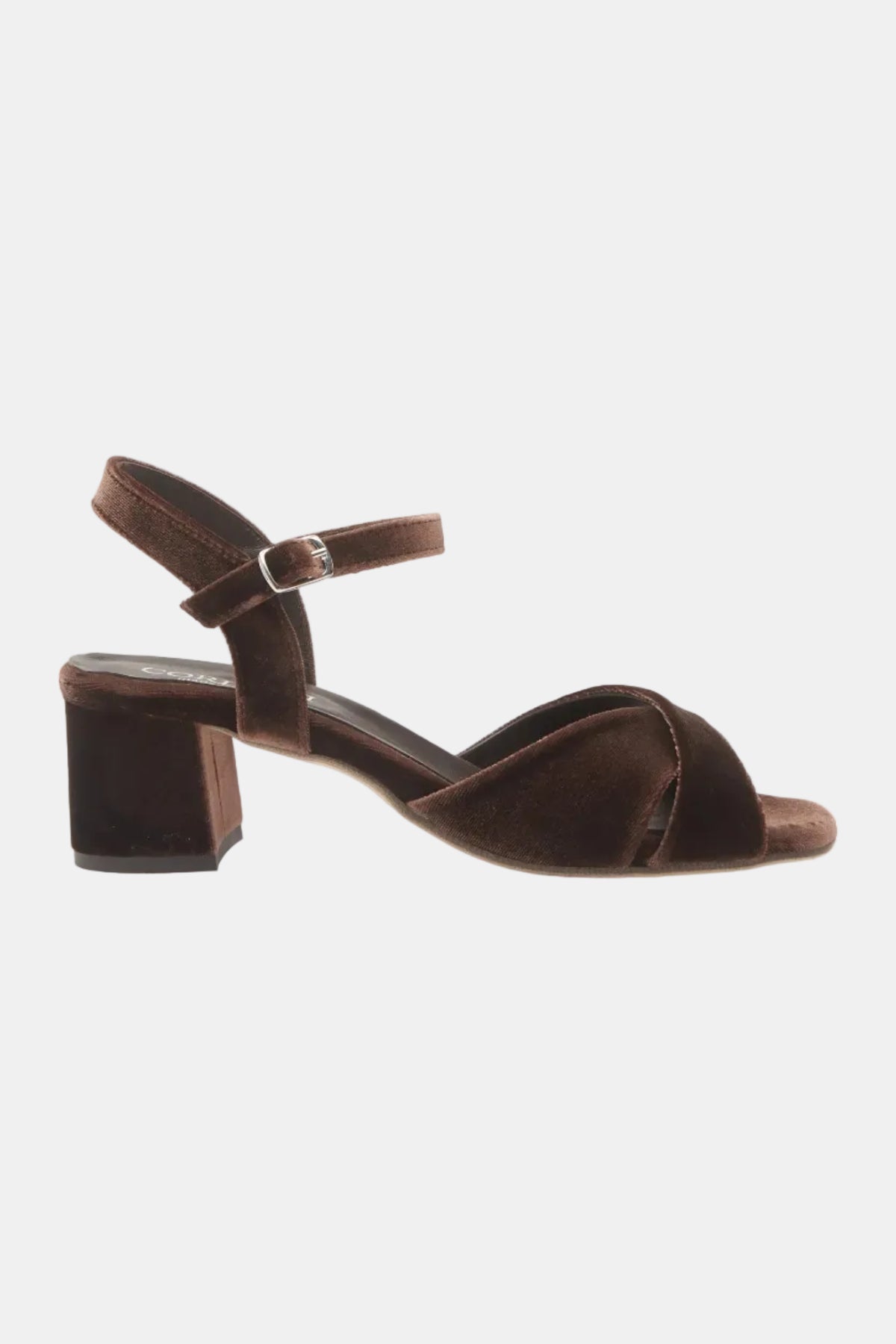 A single dark brown velvet block-heel sandal with an ankle strap and a small silver buckle, shown from a side profile on a white background.