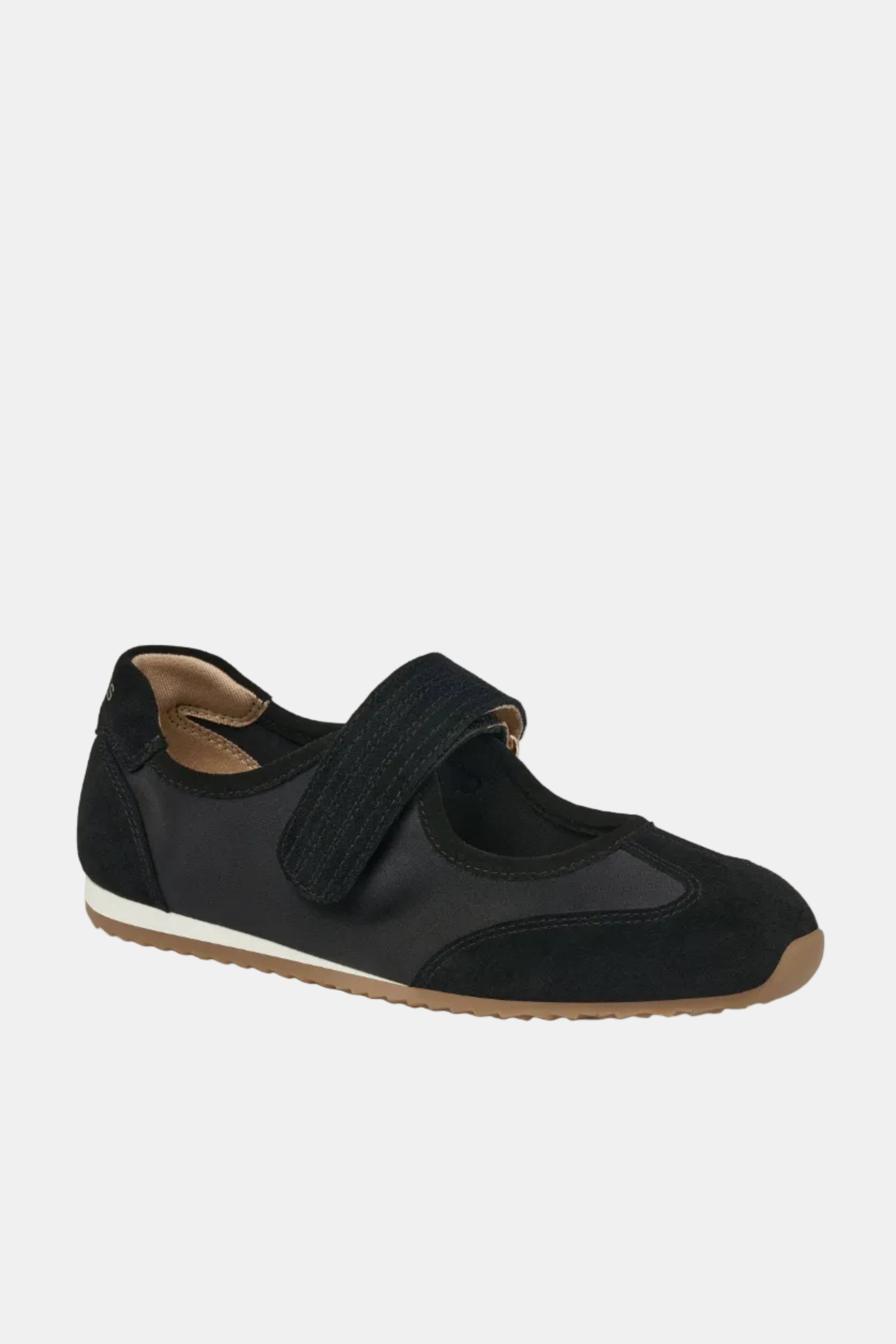 Black shoe with a velcro strap on a white background