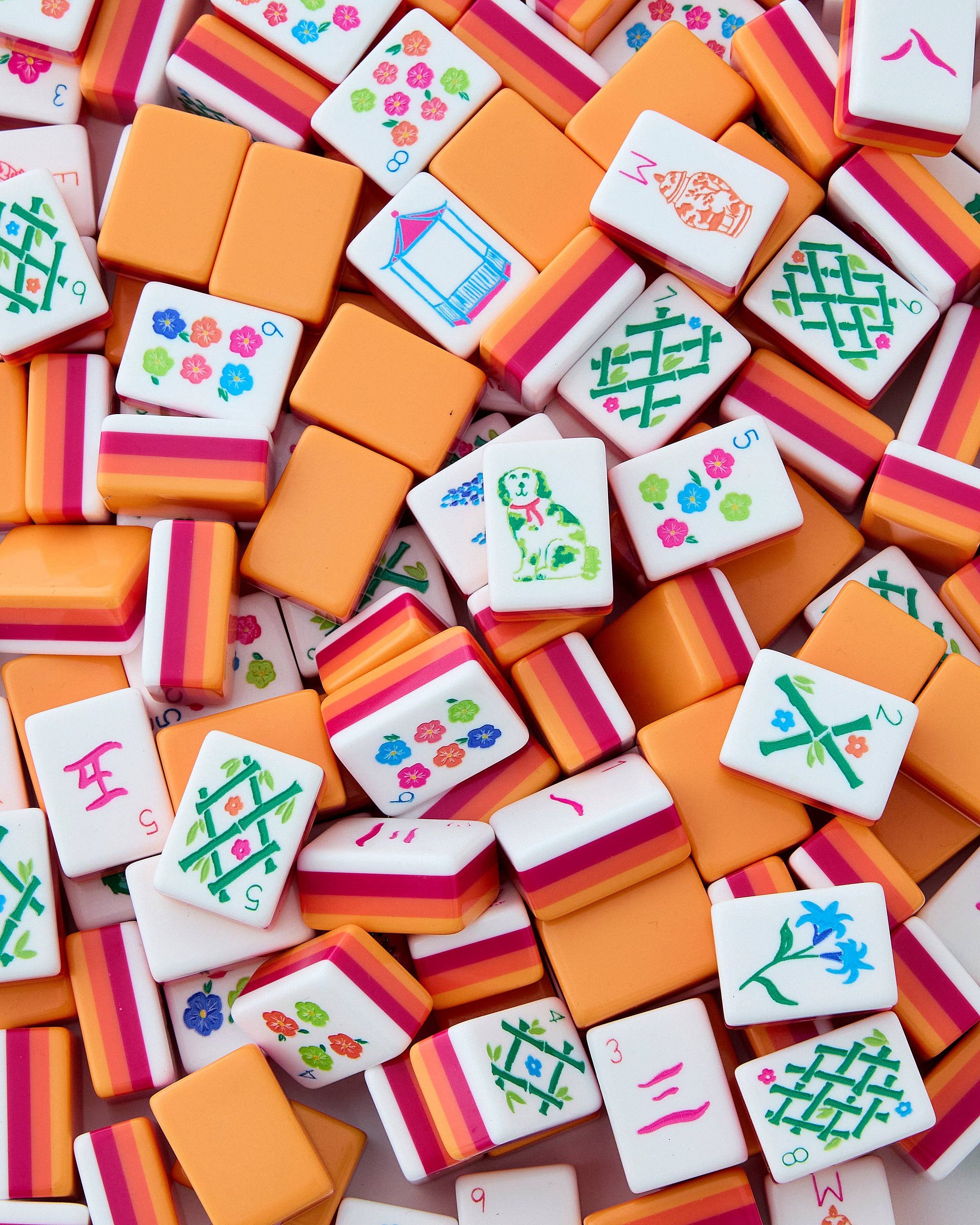 Colorful麻将 tiles with various patterns on a wooden surface