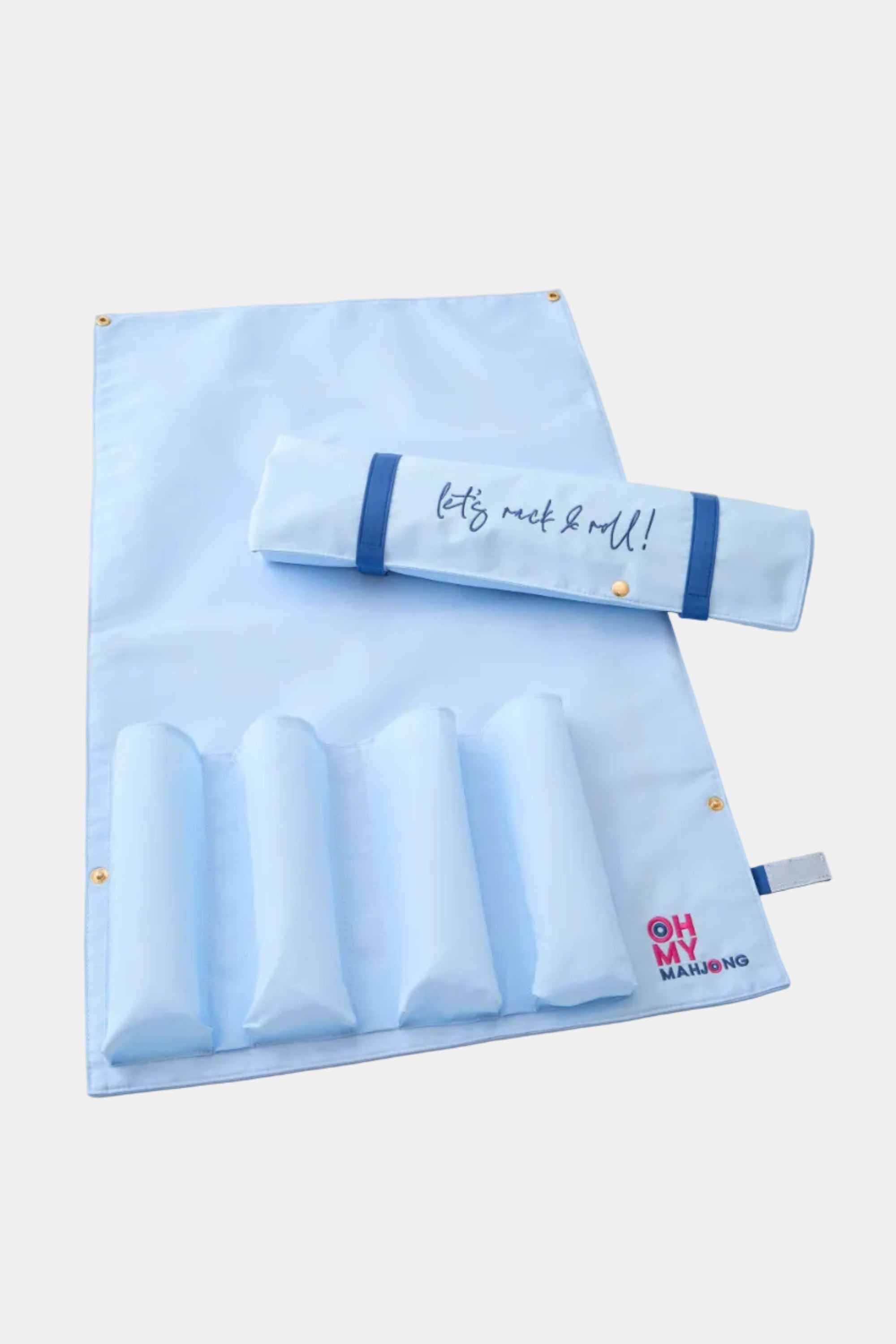 Blue baby product set with a blanket and rolled item on a light background