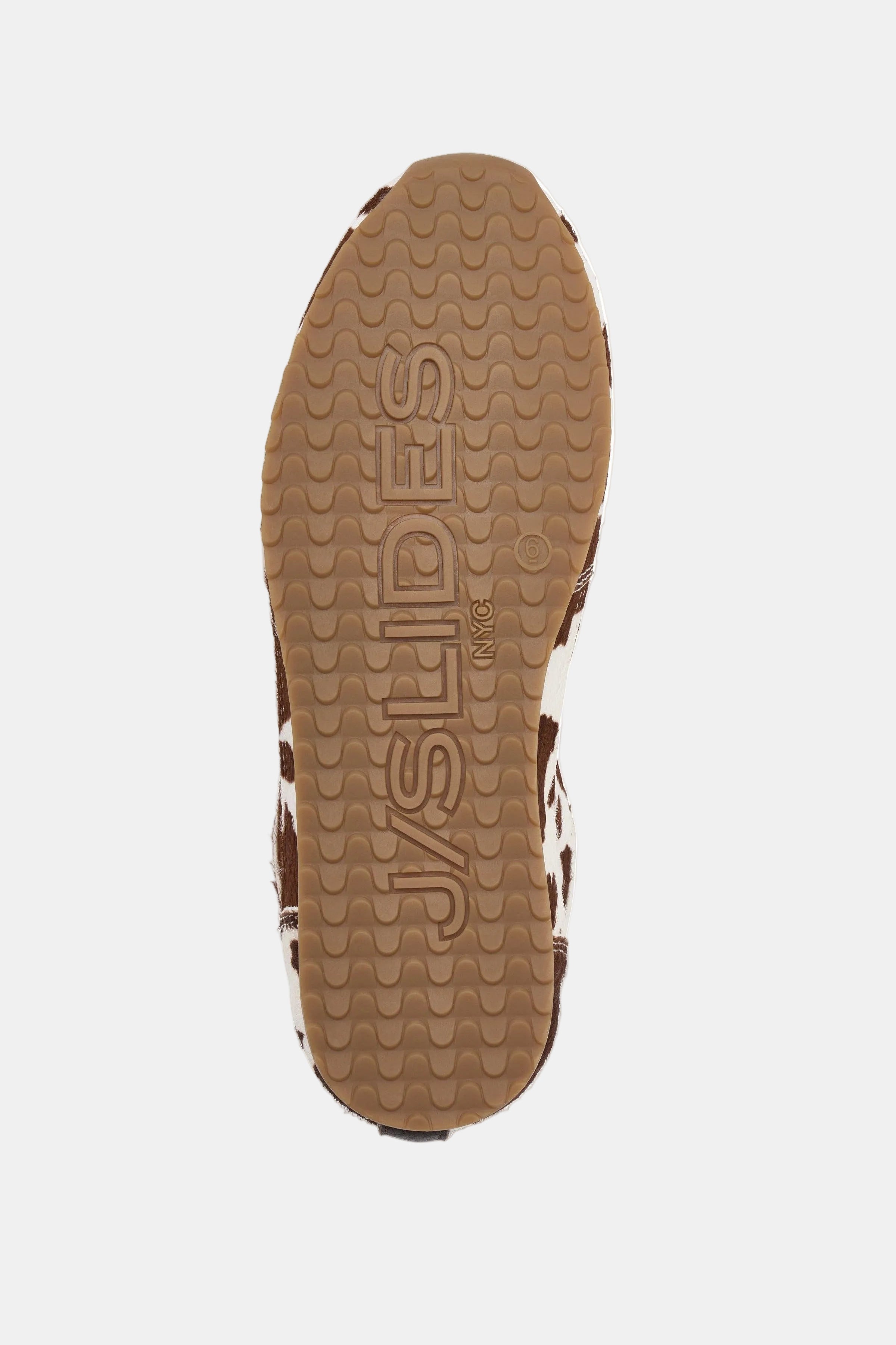 Close-up of a sandal sole with 'JSlides' branding on a white background