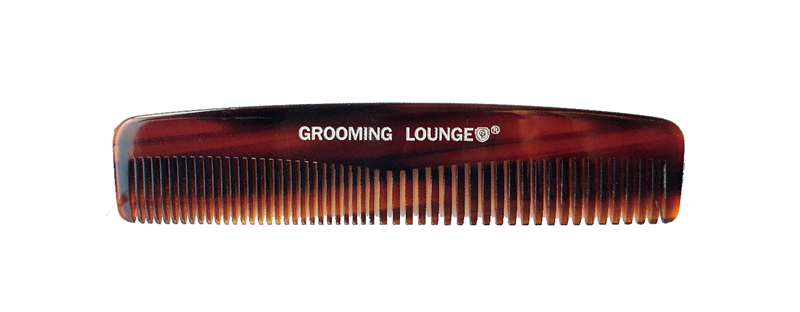 Brown comb with 'Grooming Lounge' branding on a white background