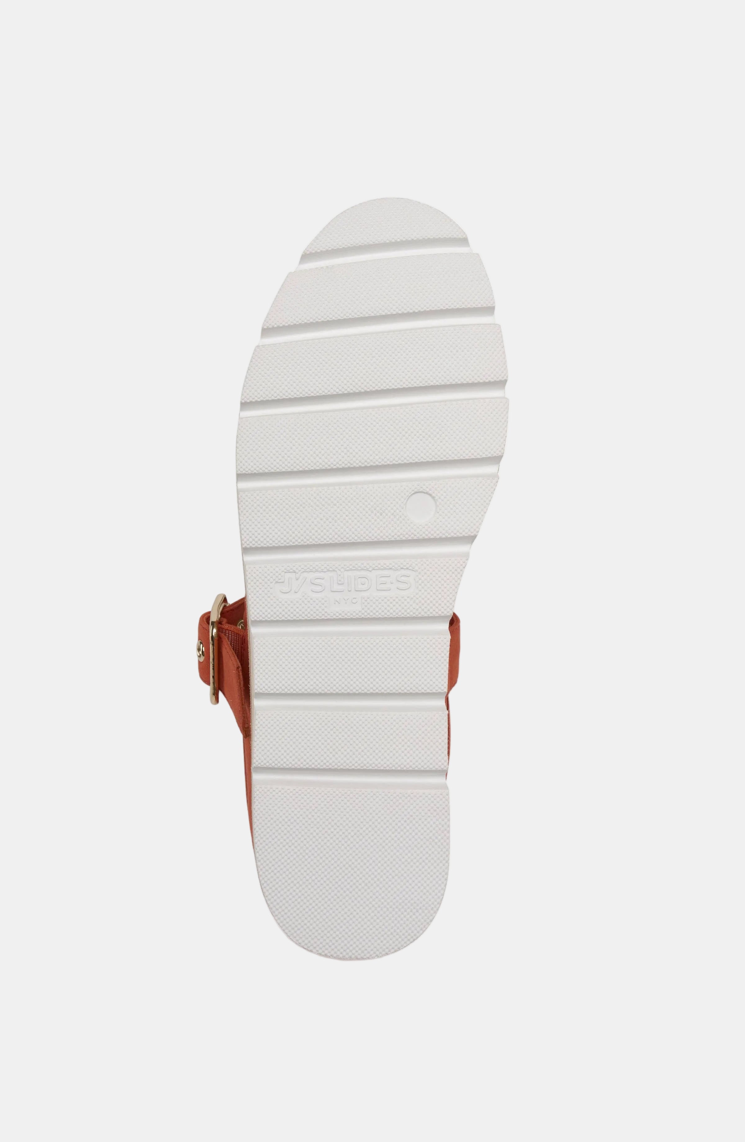 White sole of a shoe with a brown strap on a white background