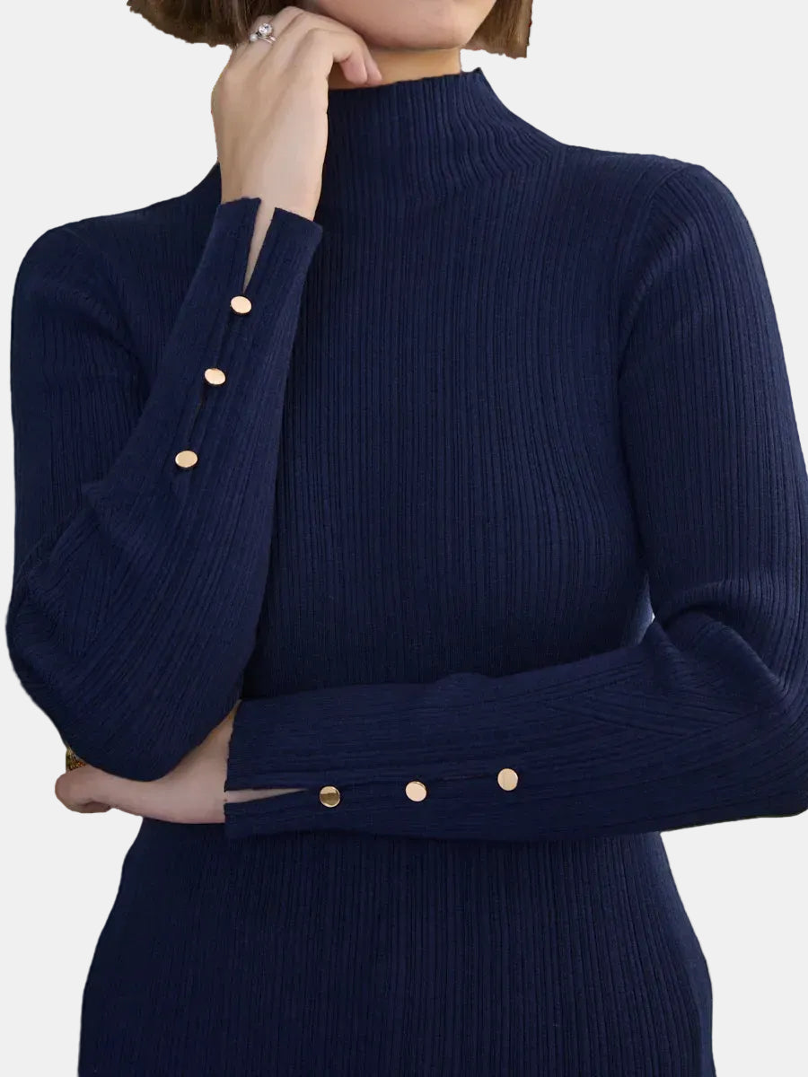 Navy blue ribbed sweater with gold buttons on a plain background