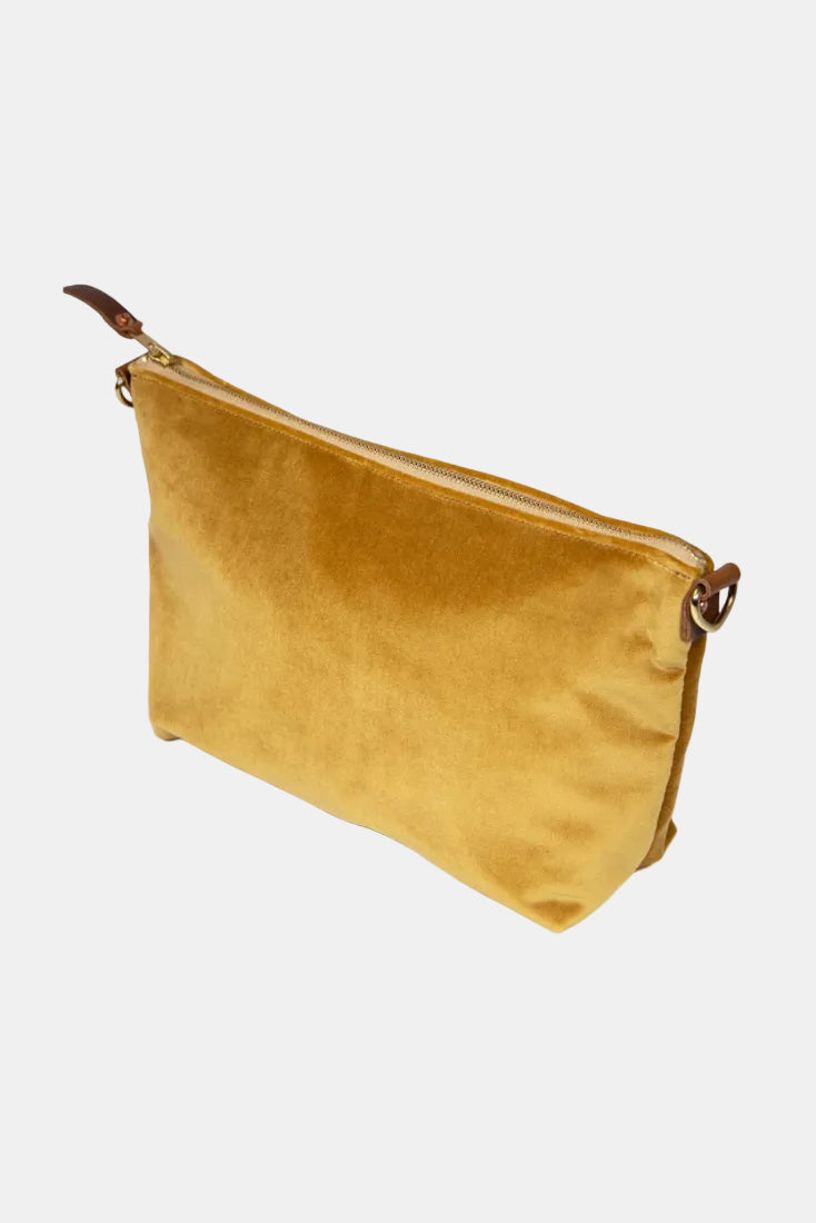 Gold velvet pouch with a zipper on a white background