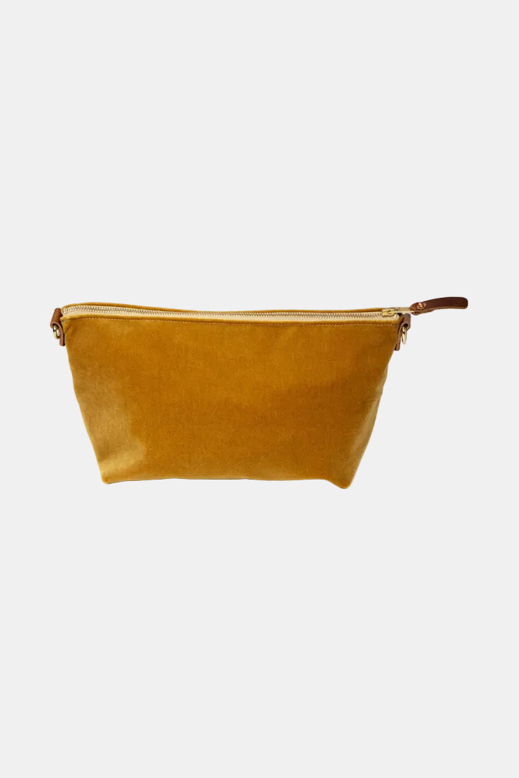 Brown leather pouch with gold zipper on a white background