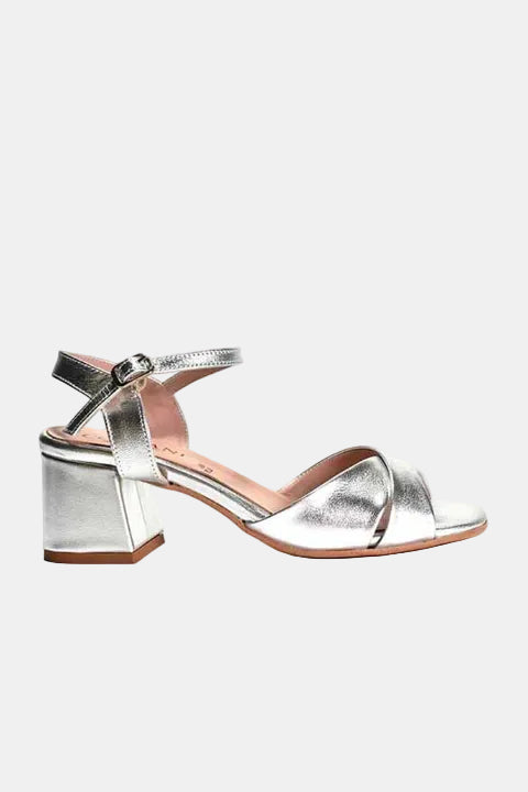 Silver sandal with a block heel on a white background