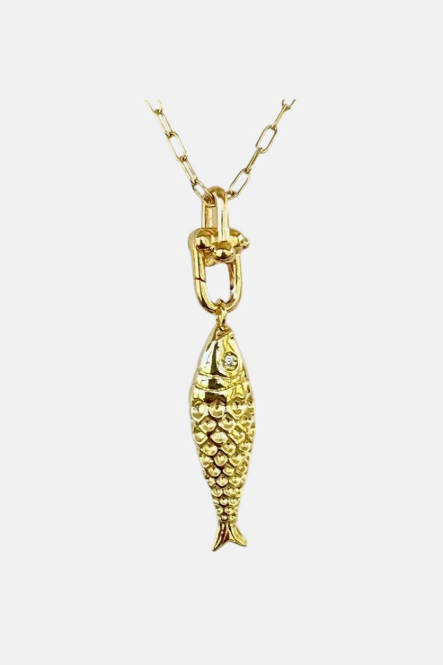 Gold fish pendant on a chain against a white background