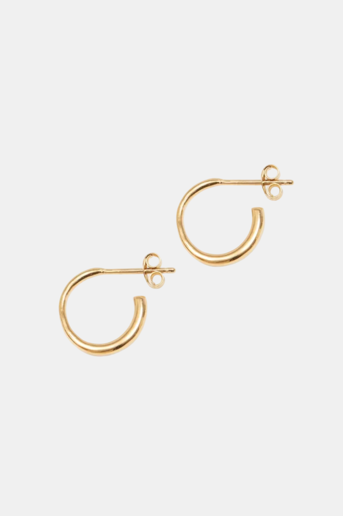 Gold hoop earrings on a white background
