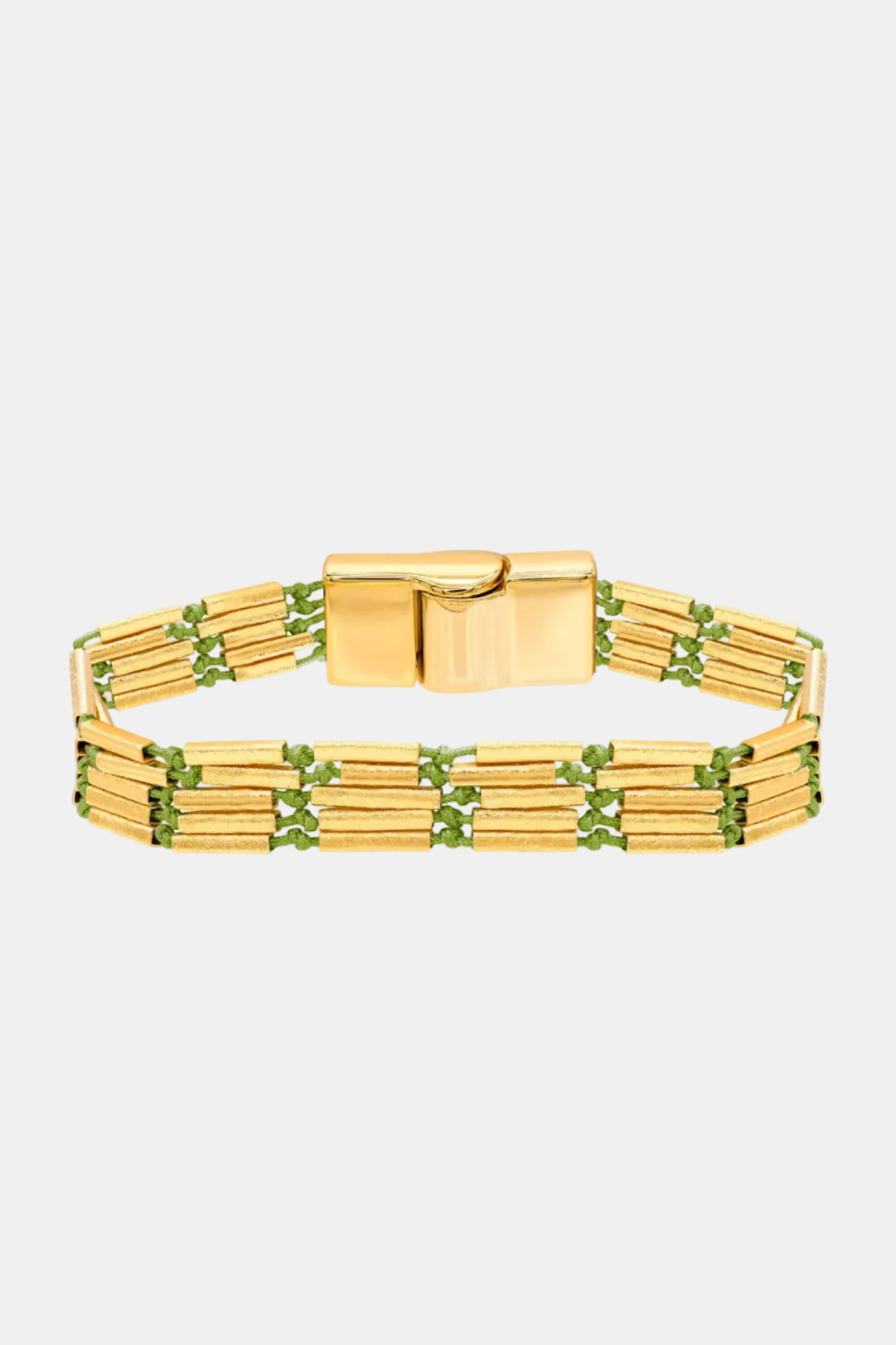 Gold bracelet with green accents on a white background