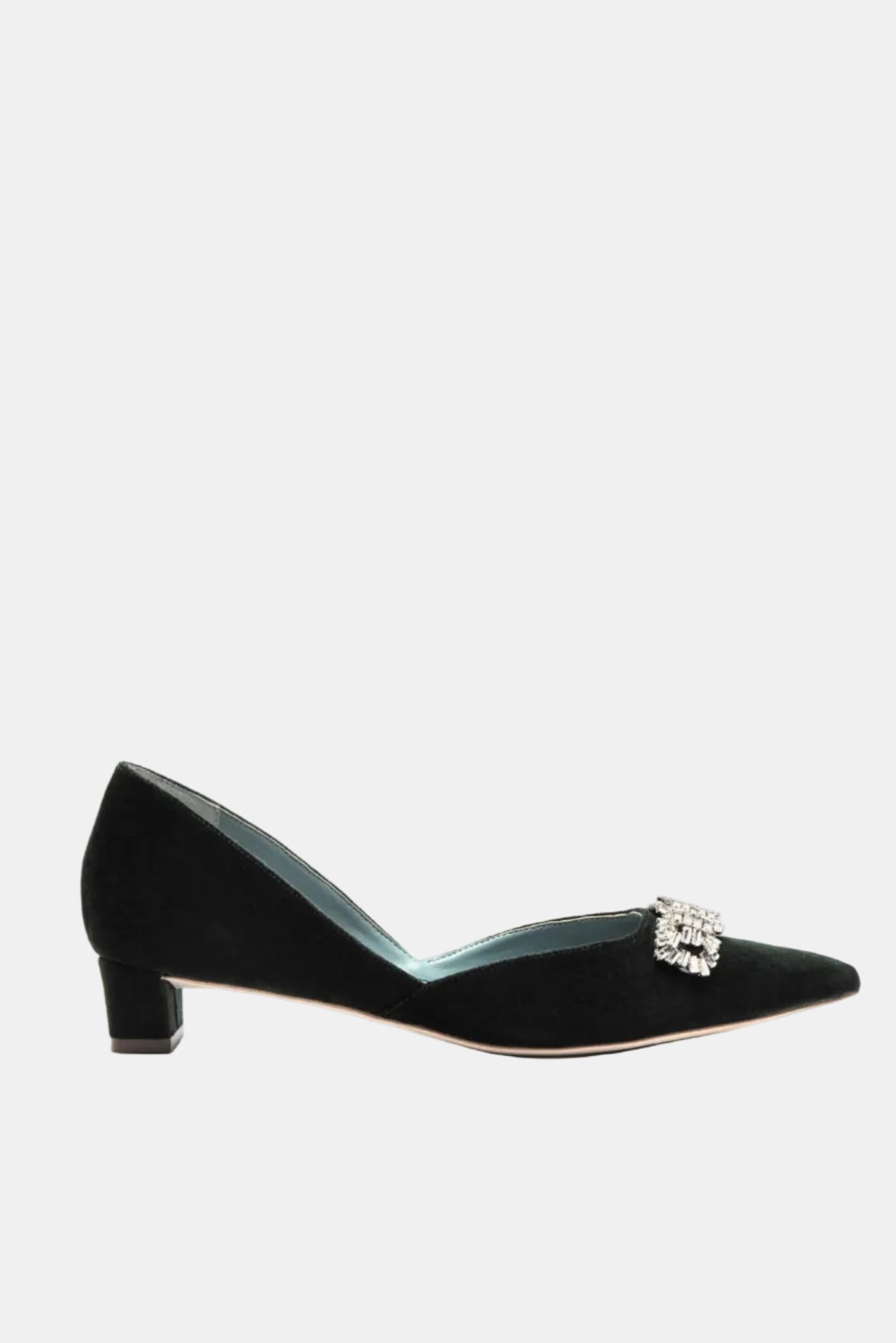 Black shoe with a decorative brooch on a white background
