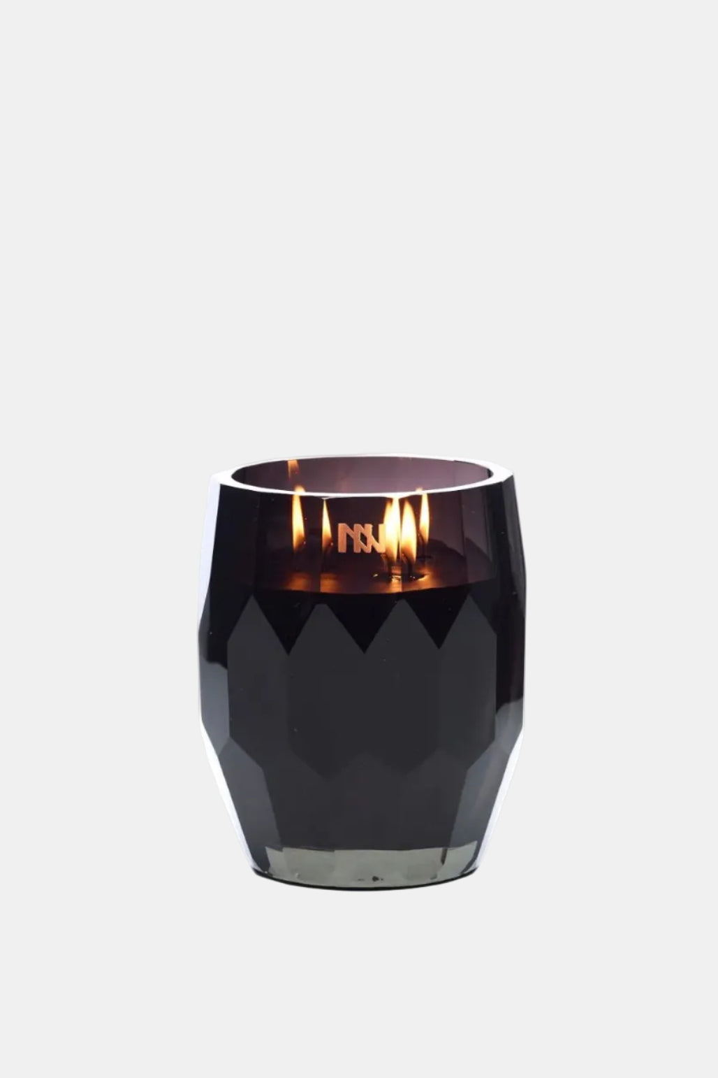 Black candle holder with a lit candle on a white background