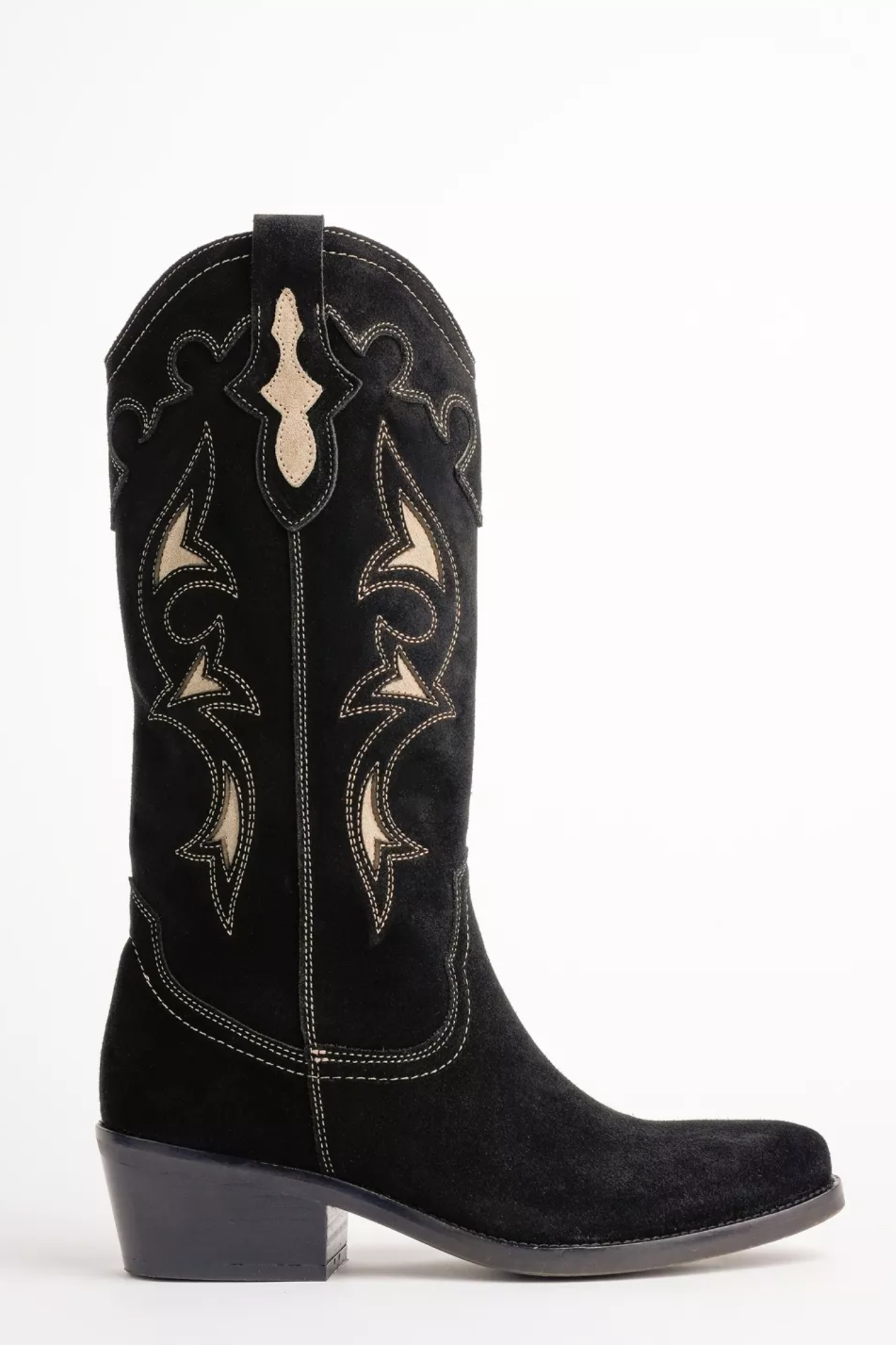 Black cowboy boot with intricate white embroidery on a white background