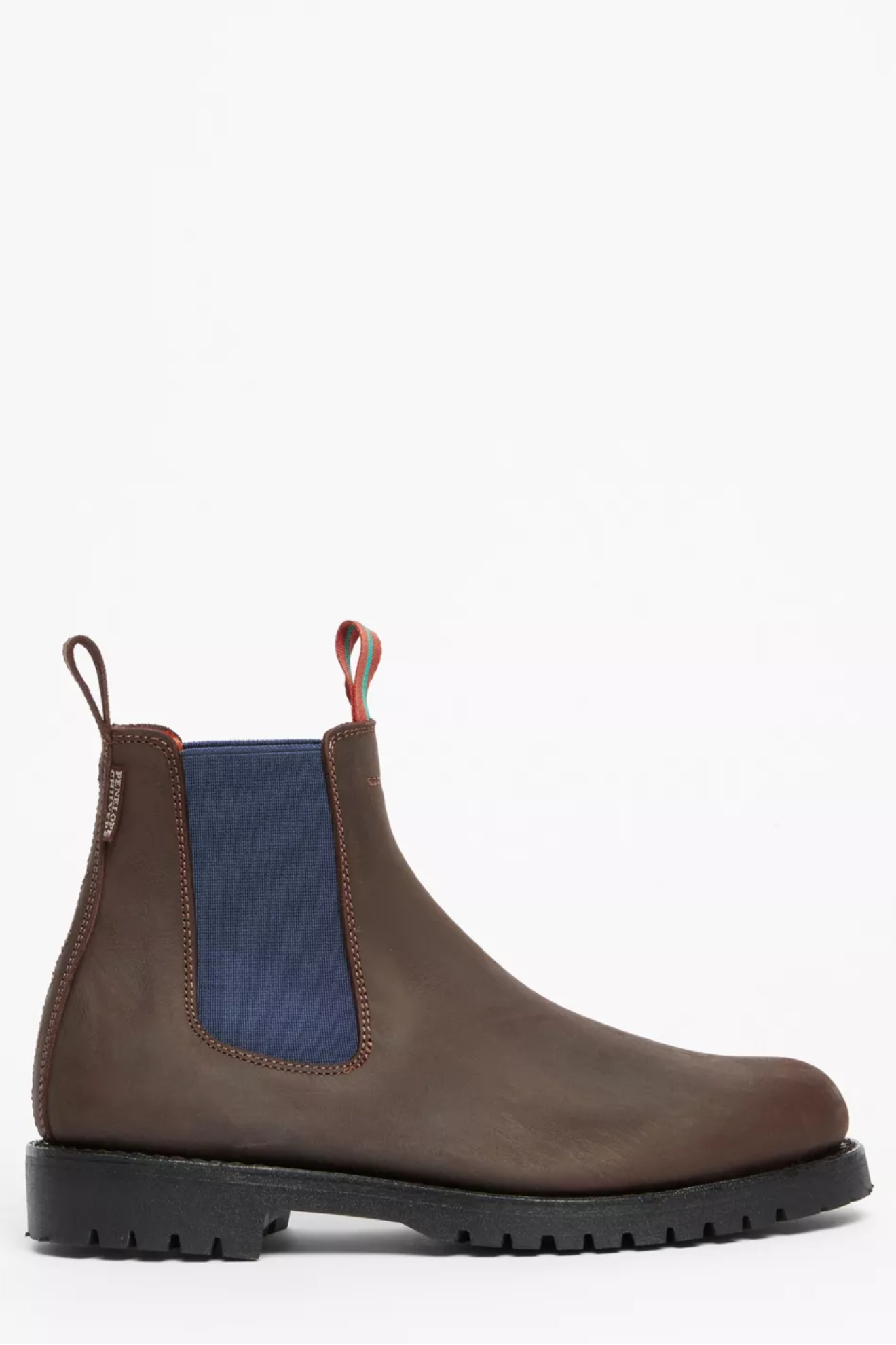 Brown Chelsea boot with blue side panel on a white background