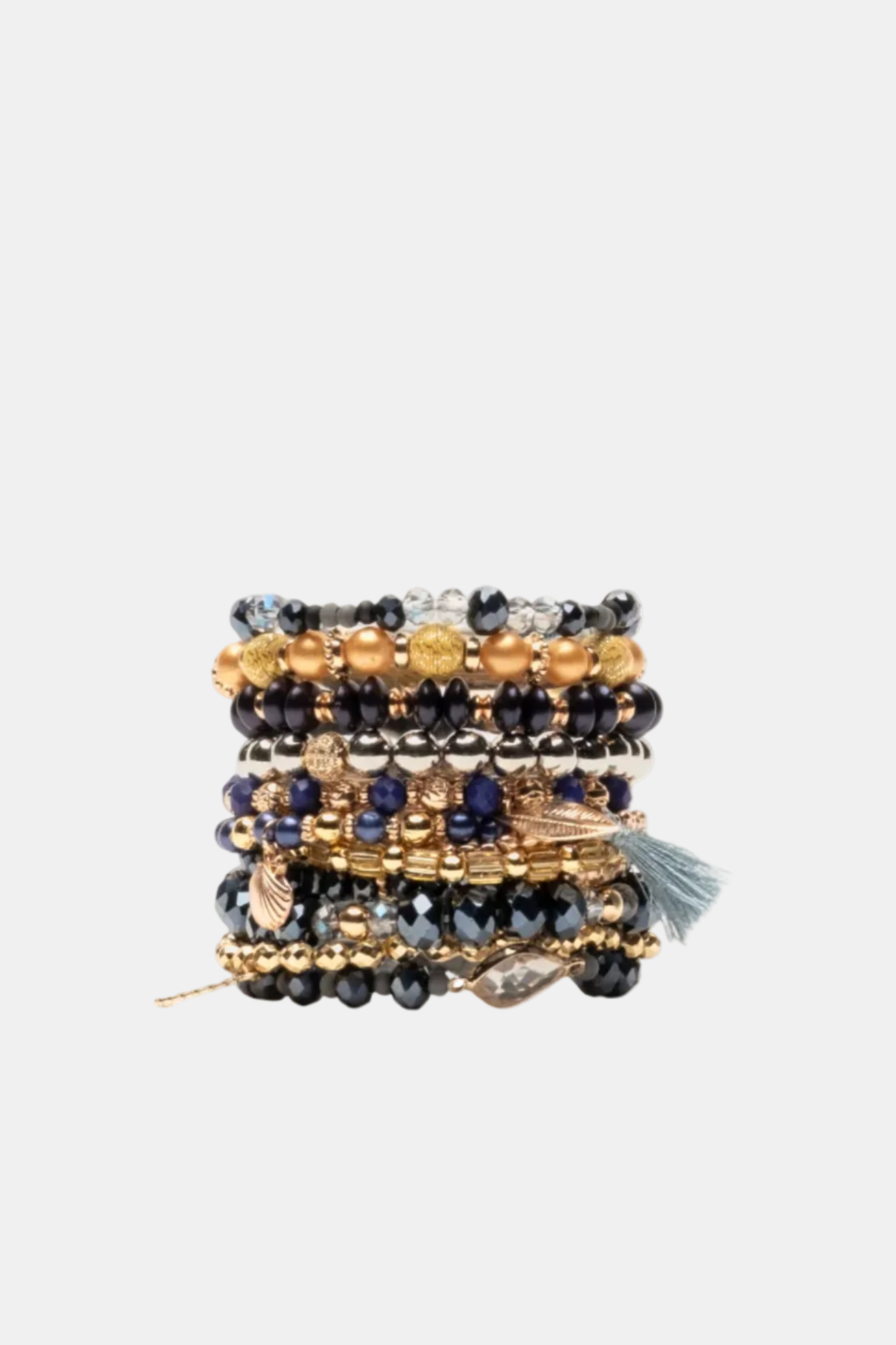 Stack of beaded bracelets with gold and black colors on a white background