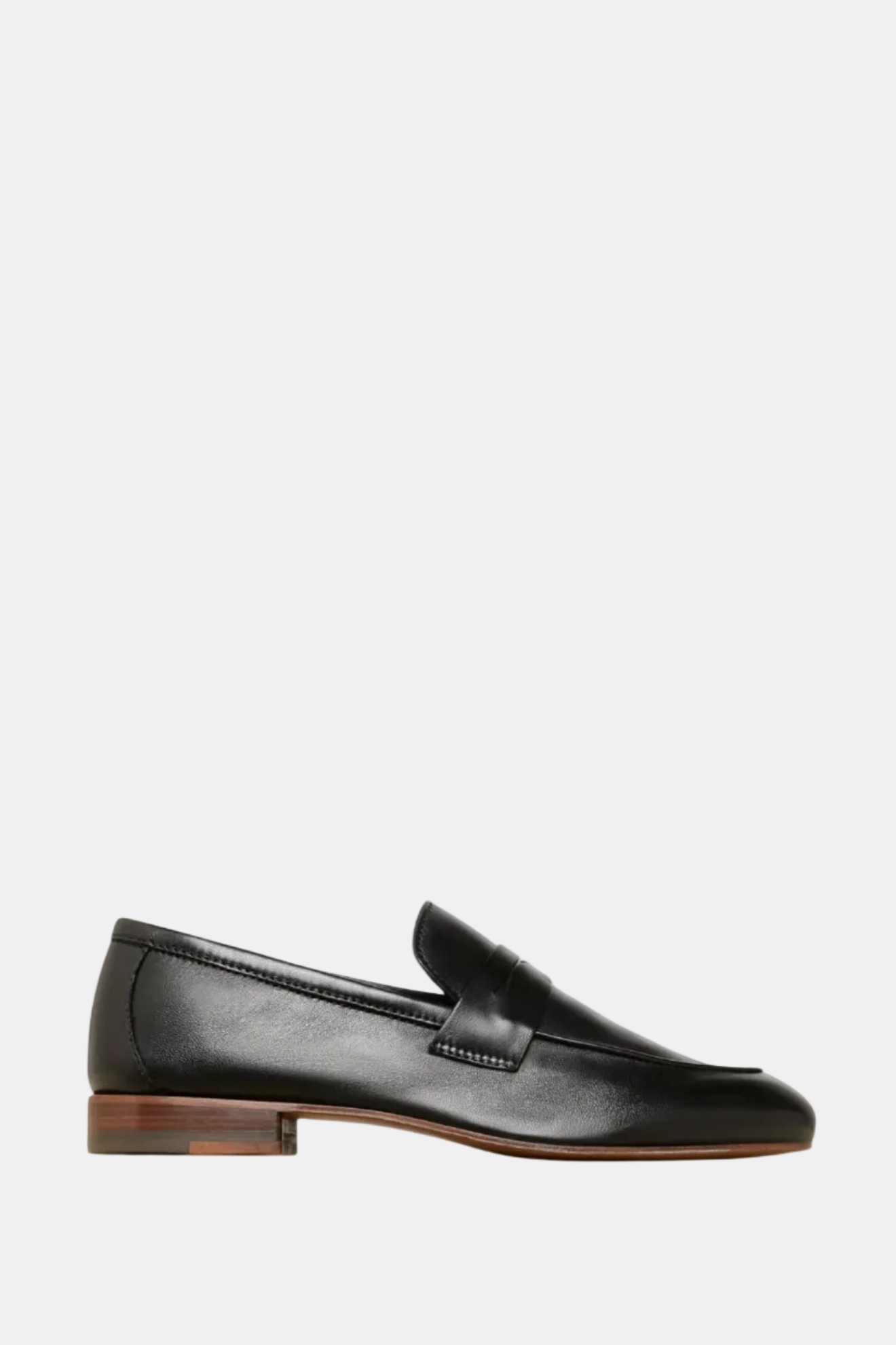 Brown loafer shoe on a white background