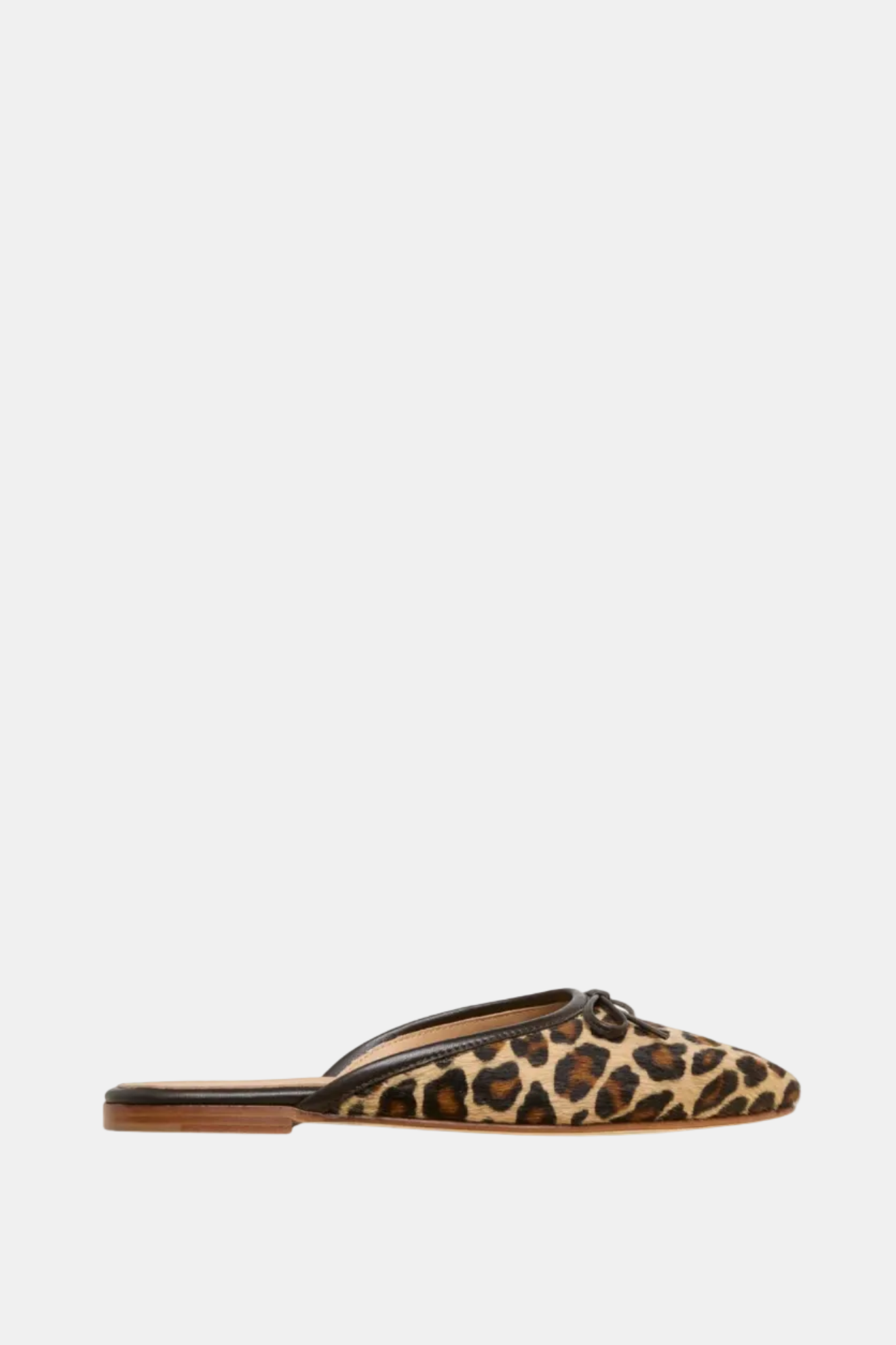 Leopard print slip-on shoe on a white background