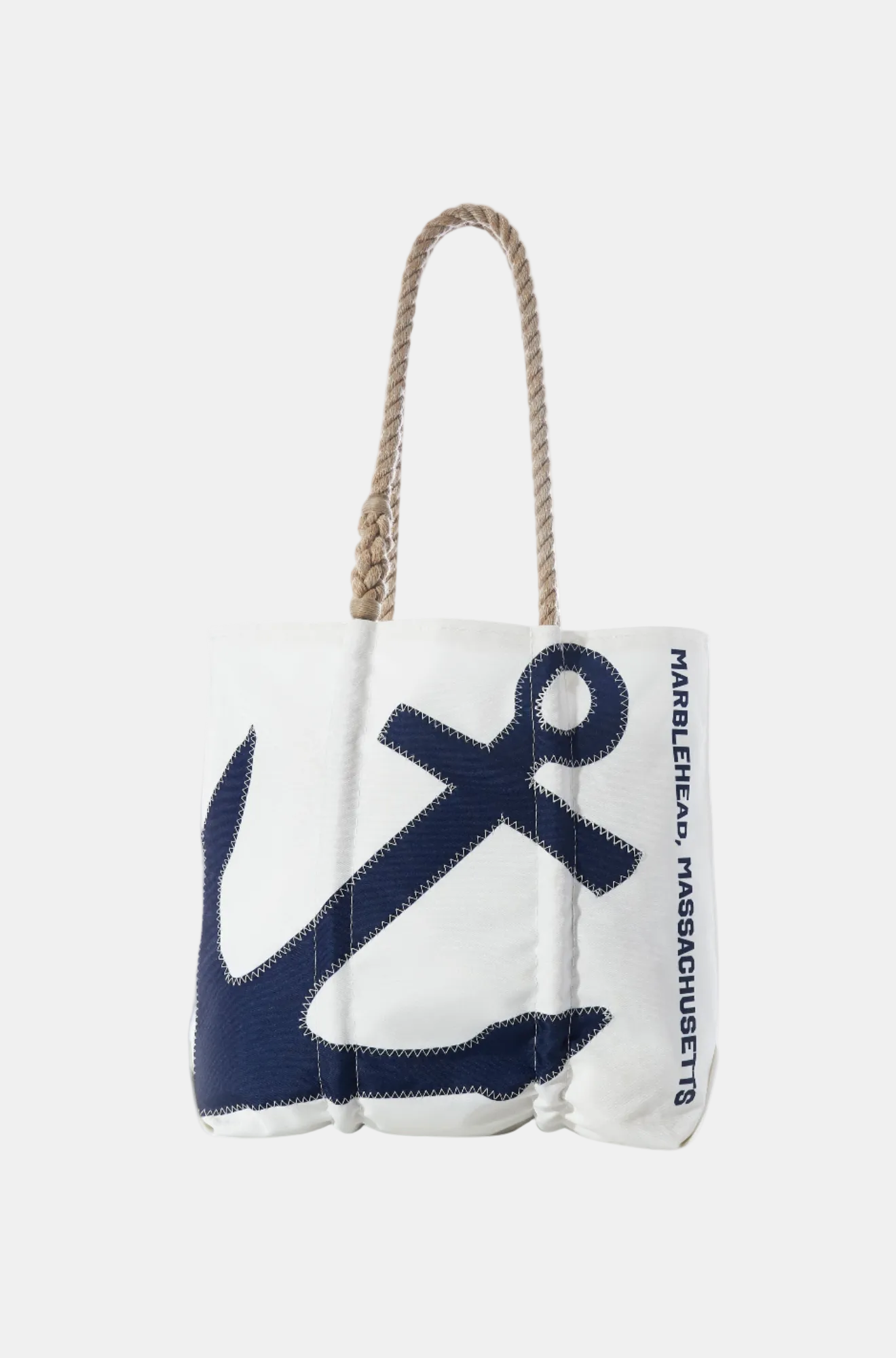 White tote bag with navy anchor design and rope handle on a white background
