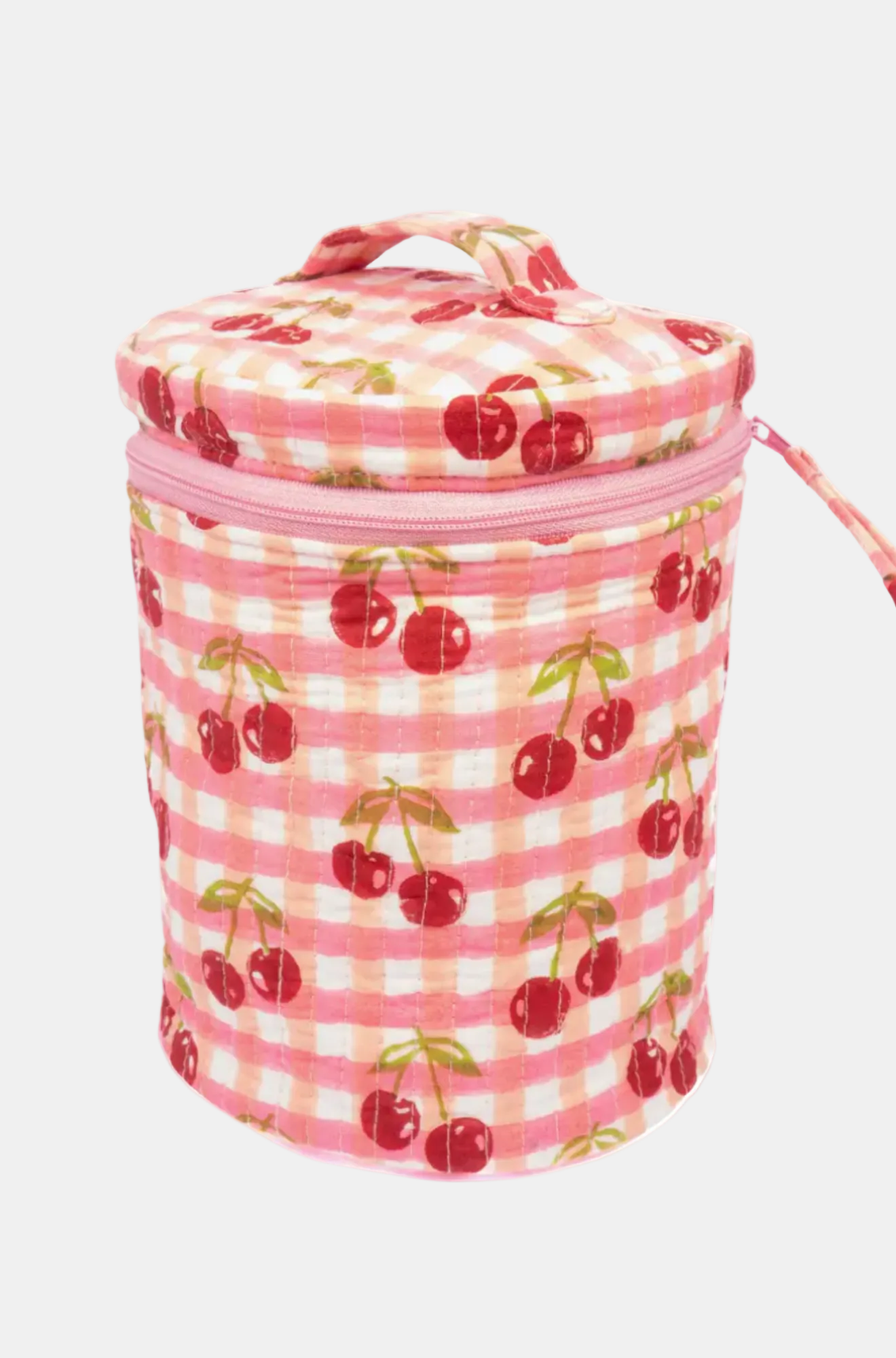 Pink insulated lunch bag with cherry pattern on a white background