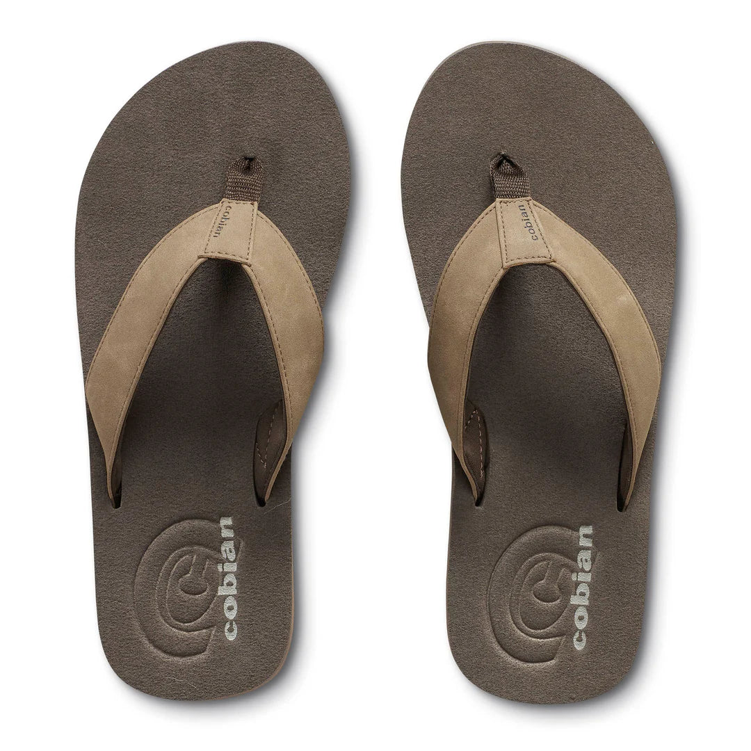 A pair of Cobián flip-flops shown from a top-down view on a white background. The sandals feature a dark brown textured footbed and a contrasting light tan suede-like thong strap.