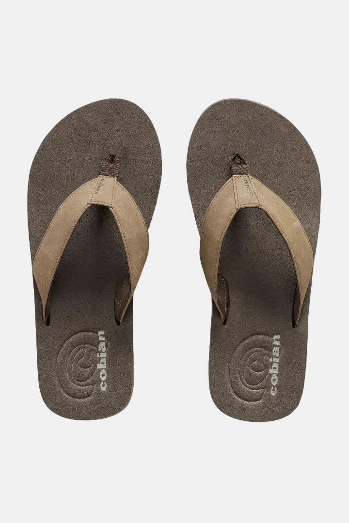 A pair of Cobián flip-flops shown from a top-down view on a white background. The sandals feature a dark brown textured footbed and a contrasting light tan suede-like thong strap.