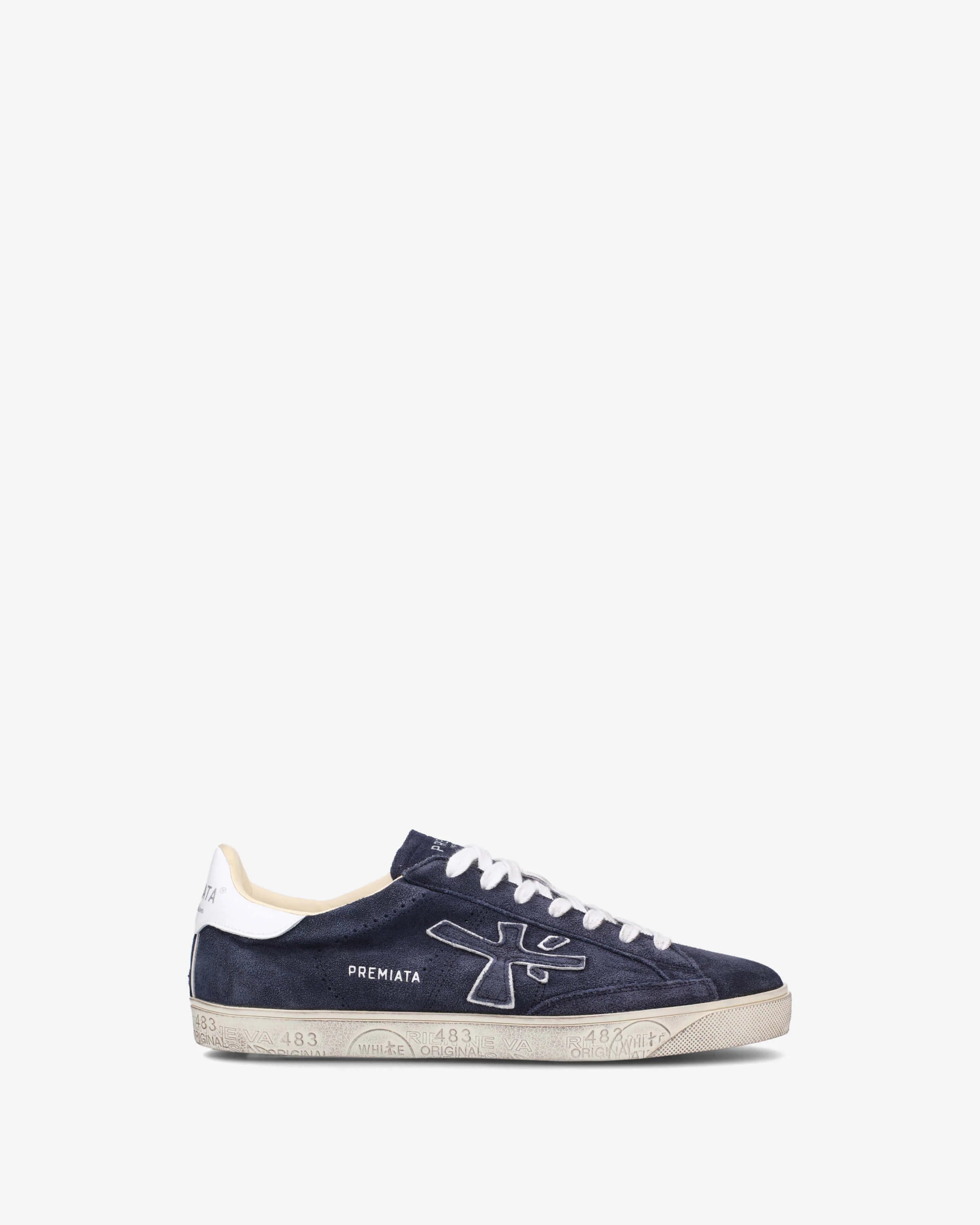 Navy blue sneaker with white accents on a white background