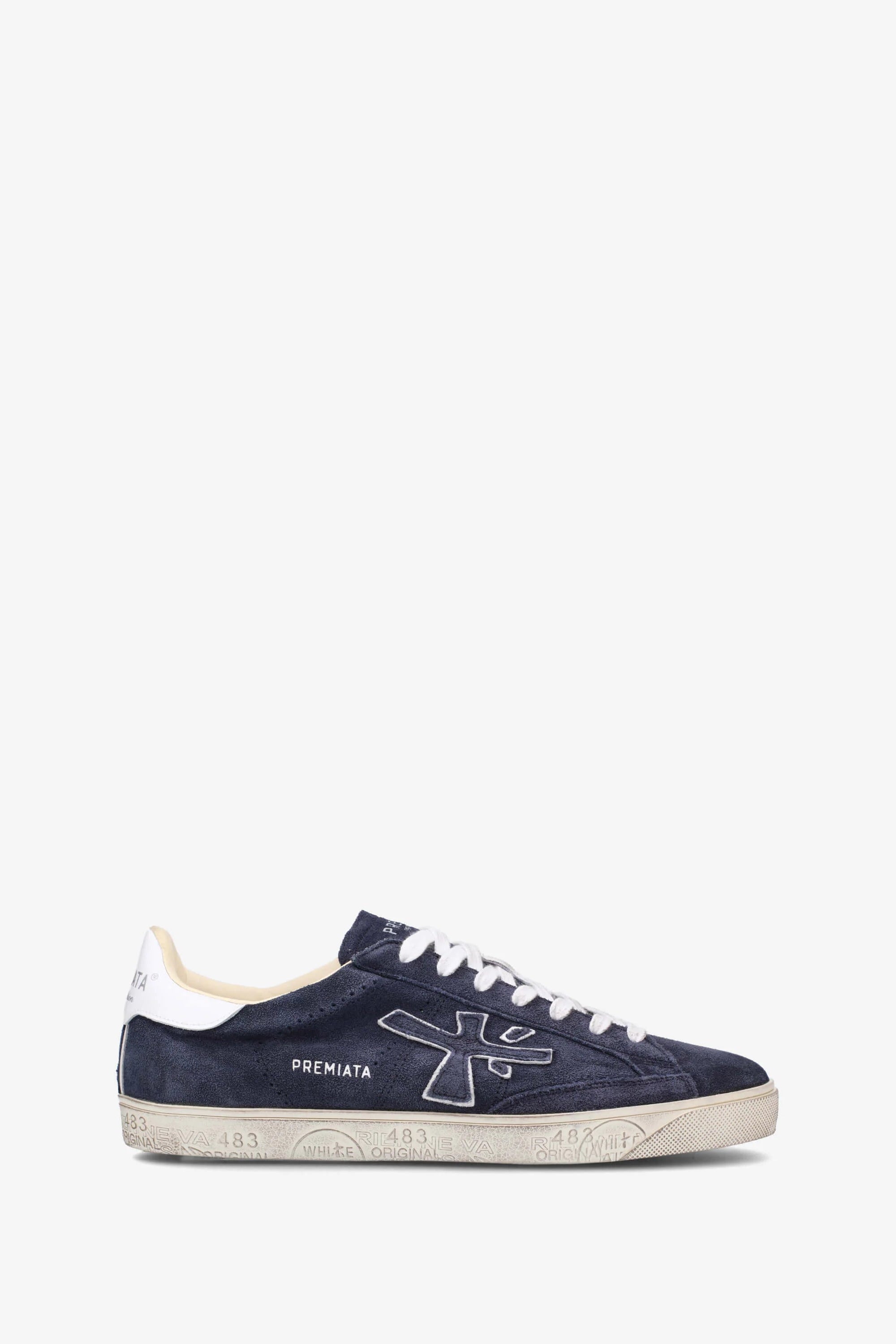Navy blue sneaker with white accents on a white background