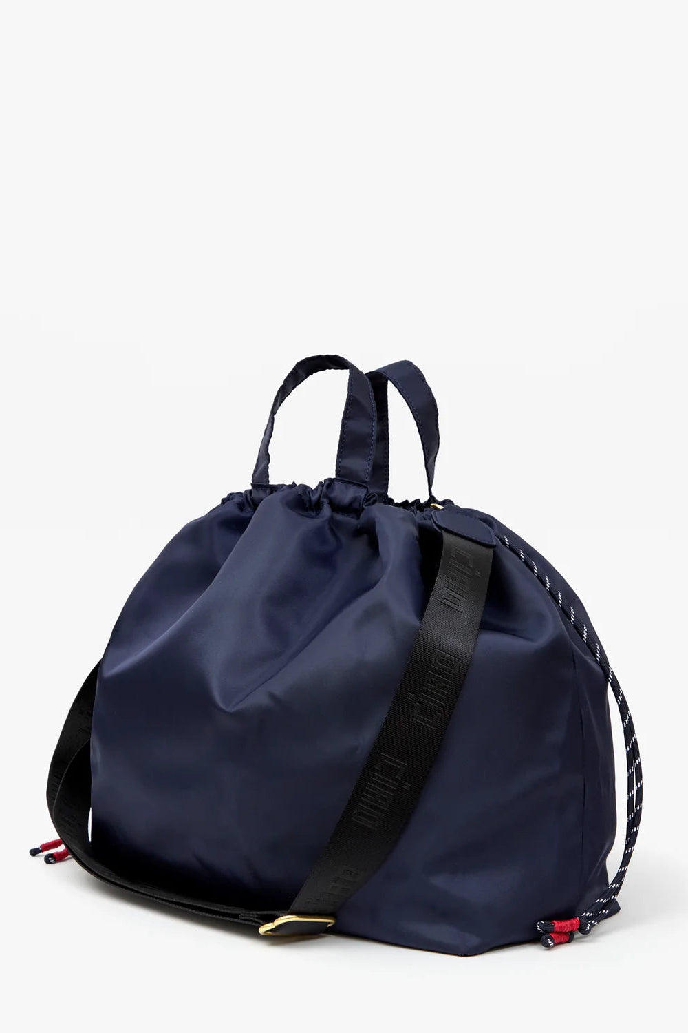A navy blue nylon drawstring backpack with a black webbed shoulder strap featuring white lettering, set against a plain white background.