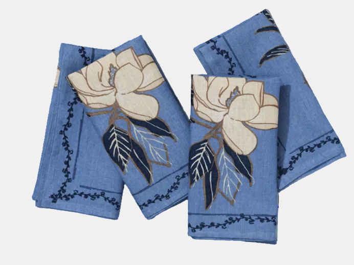 Set of blue towels with floral designs on a white background