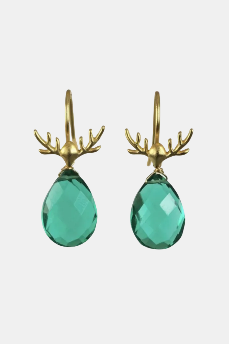 A pair of gold-tone deer antler drop earrings with faceted green teardrop-shaped crystals, shown against a plain white background.