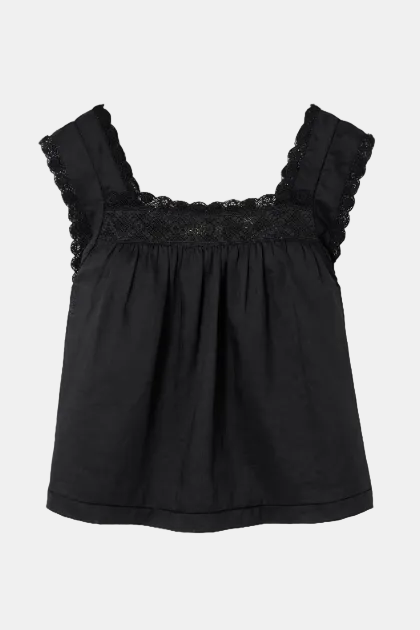 A black cotton top with a gathered waist, scalloped lace trim along the scoop neckline and shoulder straps, and a flared silhouette, shown flat on a light background.