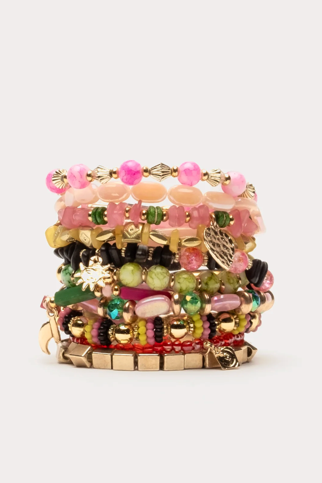 Stack of colorful beaded bracelets on a white background