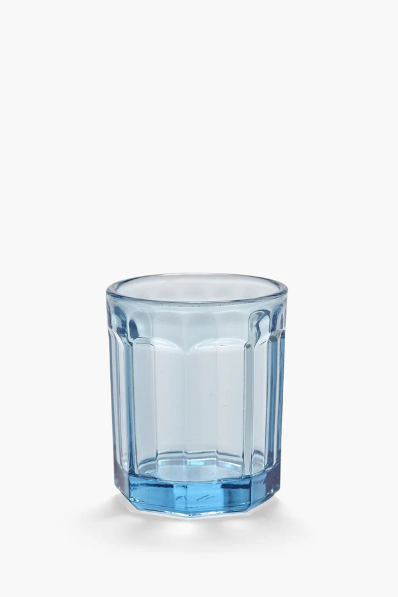 Blue glass tumbler on a white background