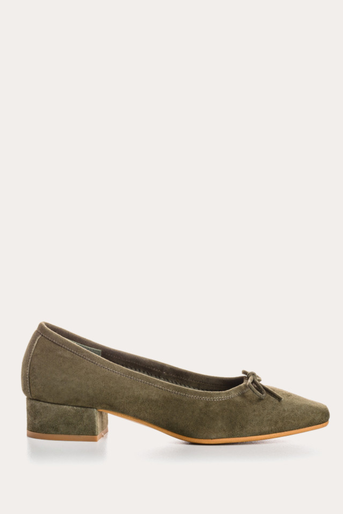 Green suede shoe on a white background