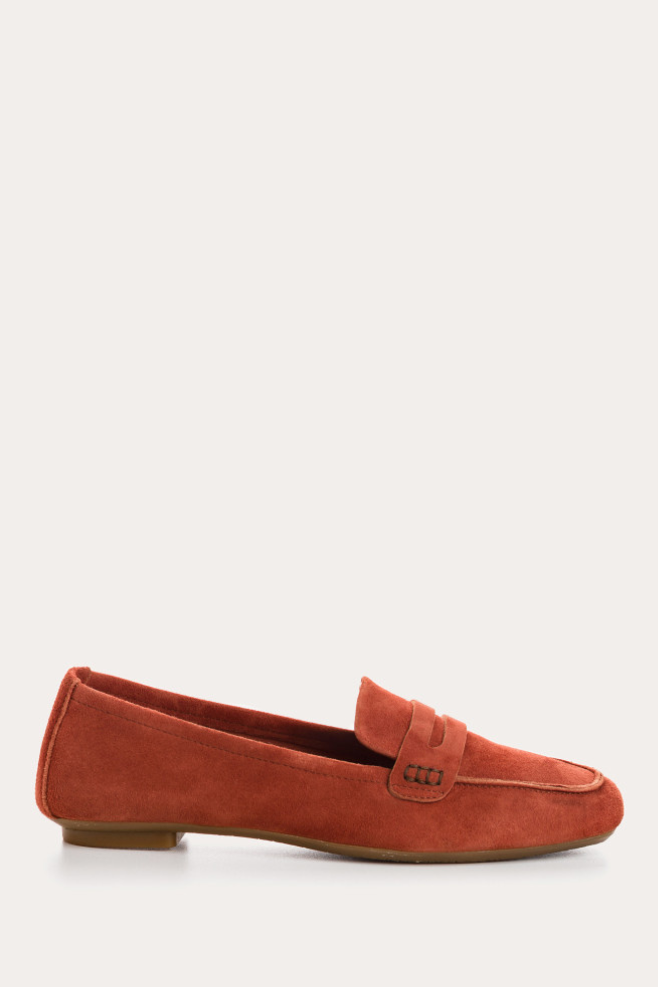 Orange loafer shoe on a white background