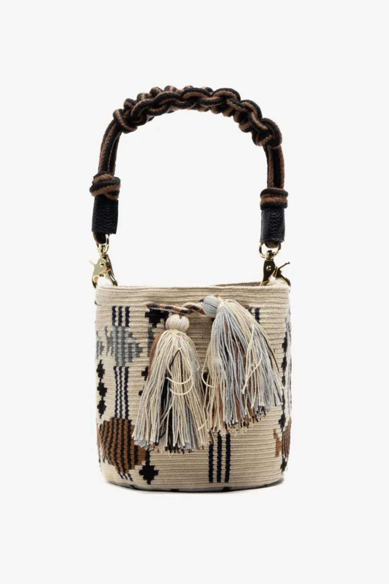 Woven handbag with decorative tassels on a white background