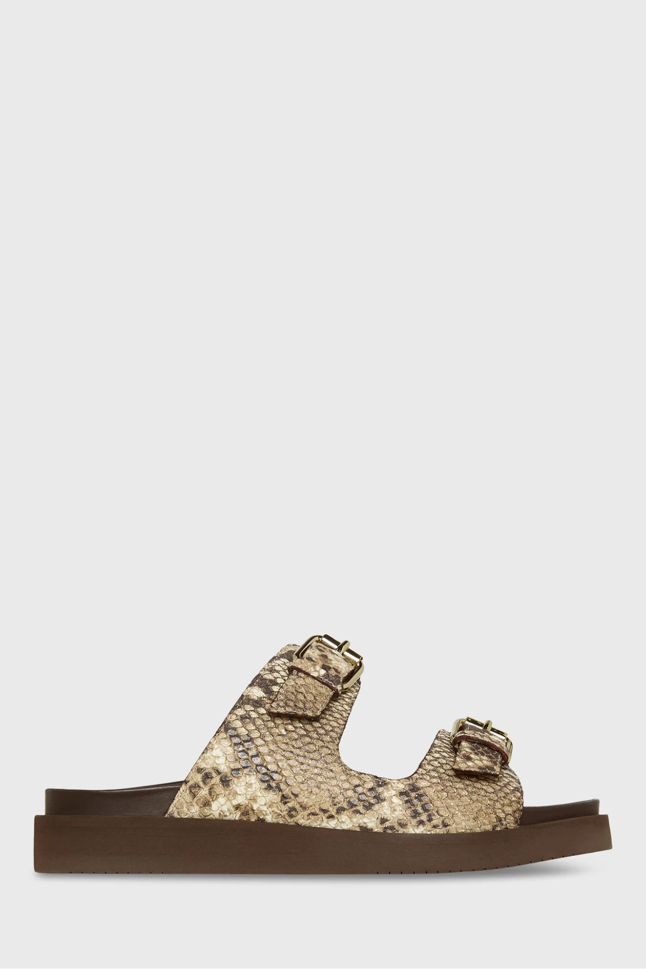 Sandal with snake print strap on a white background