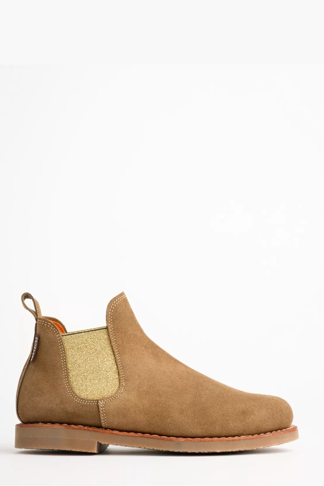 Tan Chelsea boot on a white background