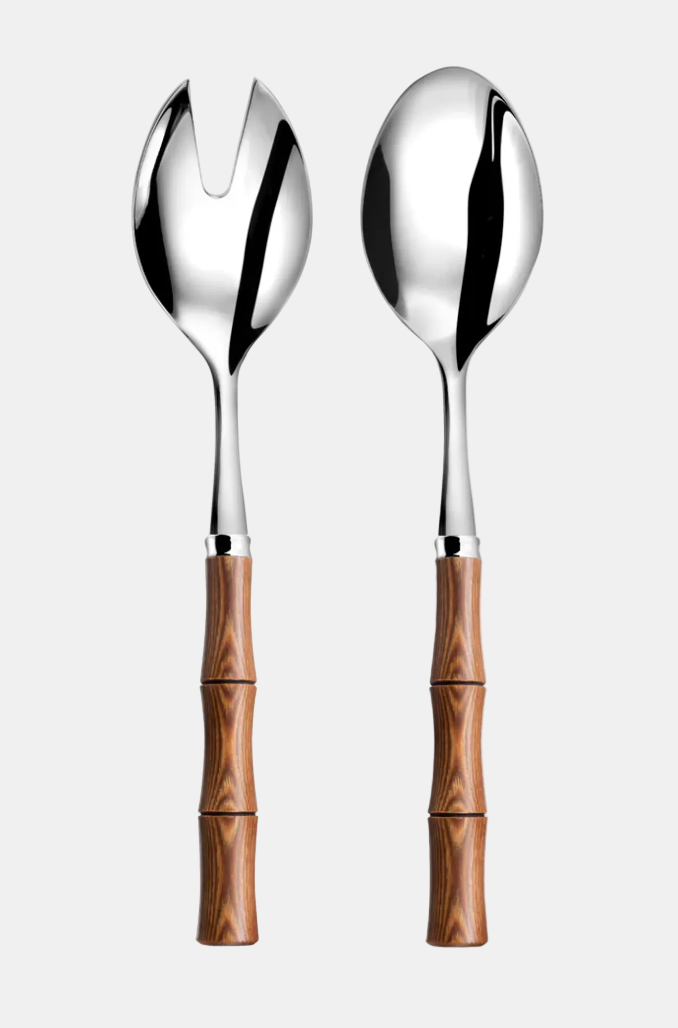 Two silver salad servers with wooden handles on a white background