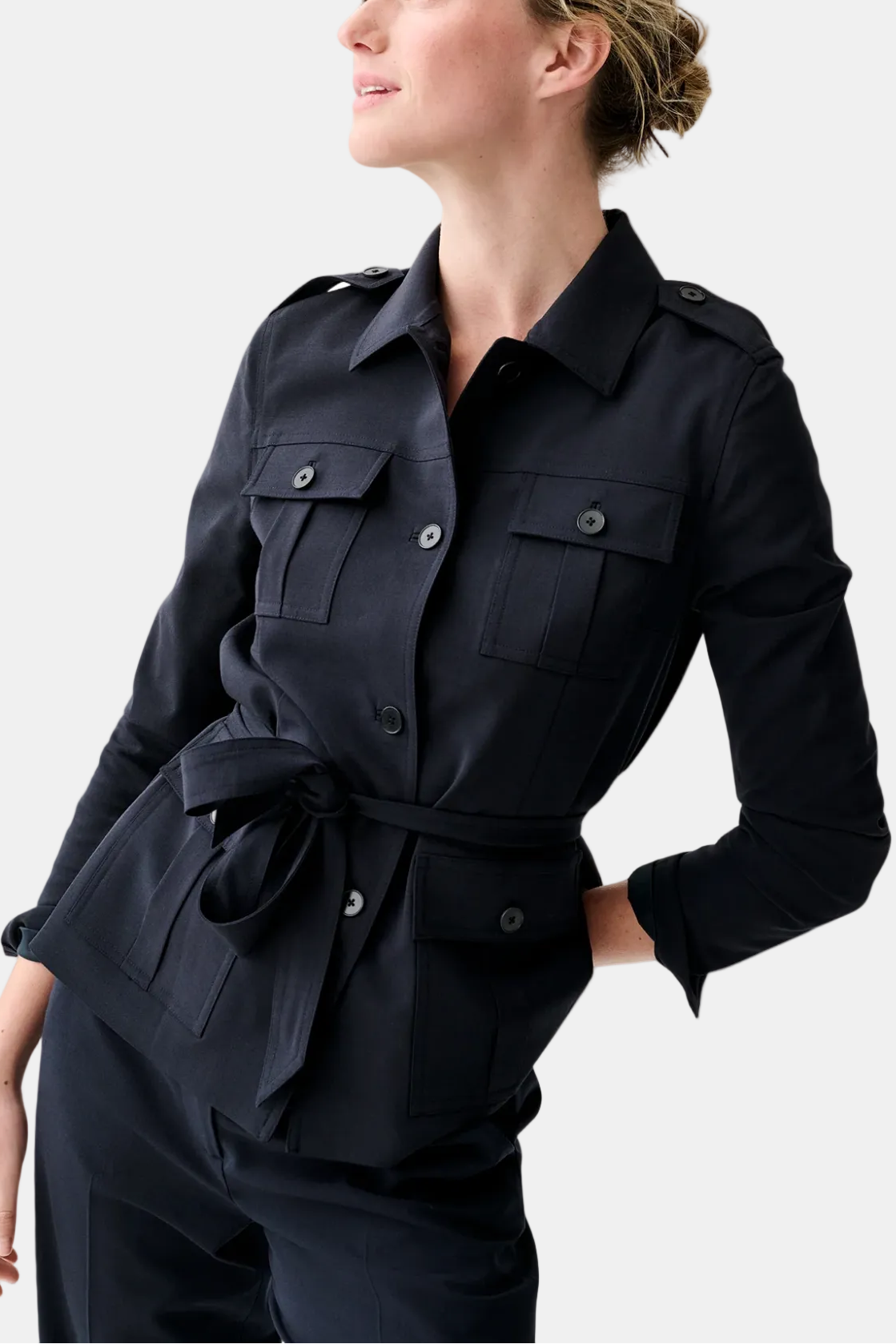 Woman wearing a black jacket on a white background