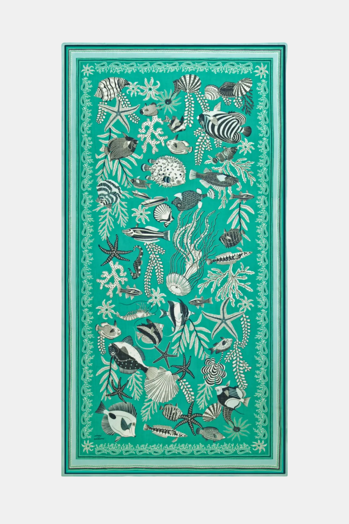 Teal rug with black and white ocean-themed design featuring fish and sea plants.