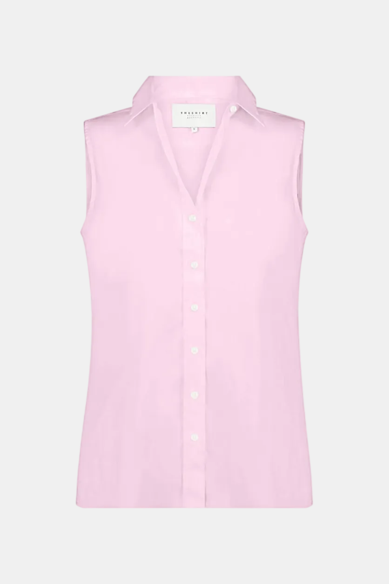 A light pink sleeveless button-up shirt with a pointed collar, displayed on a neutral light gray background.